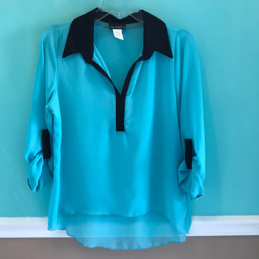 Ladies sheer rolled sleeve black and blue top